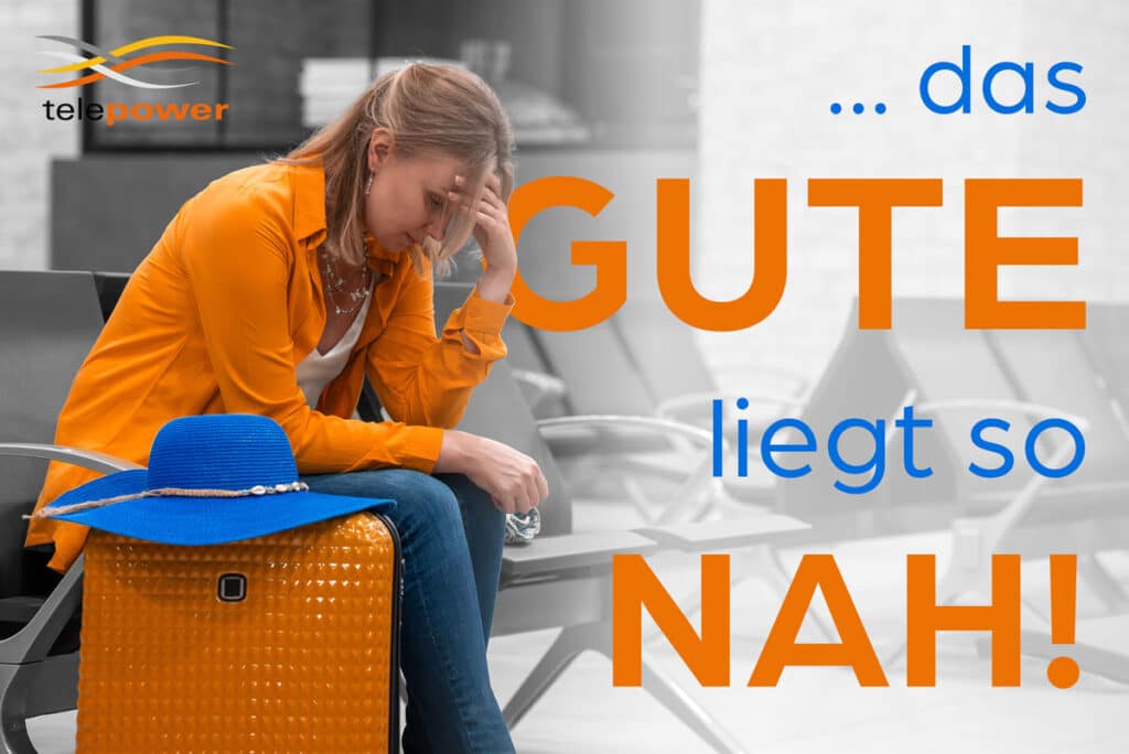 A woman in orange clothing sits exhaustedly on a waiting bench with an orange suitcase and a blue hat on it. She rests her head on one hand, while the background is in black and white. The text „...the good is so close!“ is superimposed in orange and blue lettering. The Telepower logo is in the top left corner. The scene conveys a message about proximity and accessibility.
