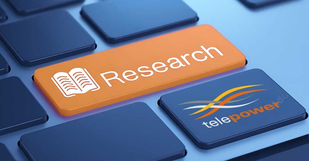 Keyboard with an orange key showing 'Research' and the Telepower logo.